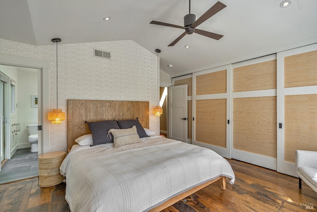 bedroom featuring vaulted ceiling, wood finished floors, recessed lighting, ensuite bathroom, and ceiling fan