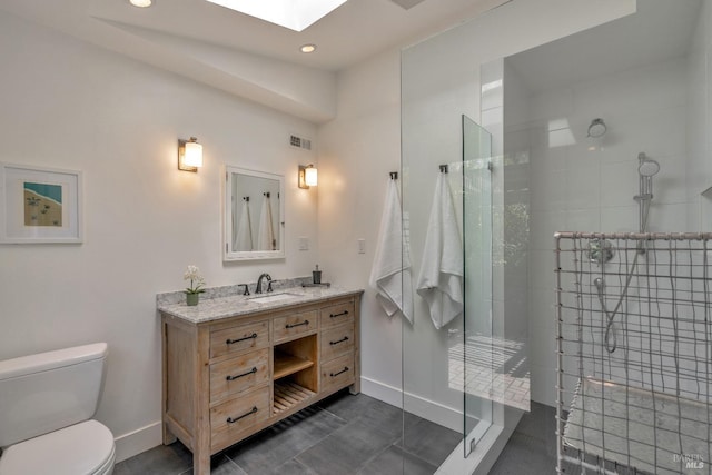 full bathroom featuring baseboards, toilet, a stall shower, vanity, and recessed lighting