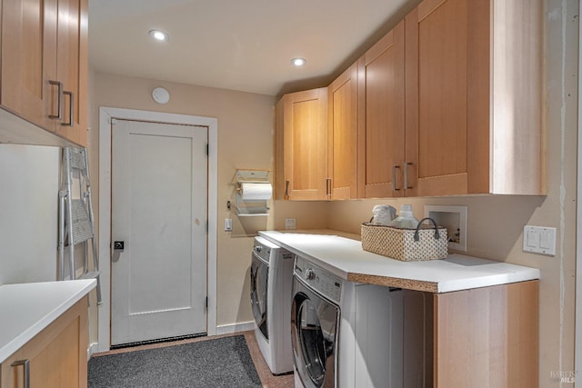 laundry area with cabinet space, washing machine and clothes dryer, recessed lighting, and baseboards