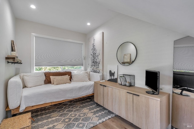 bedroom with wood finished floors and recessed lighting