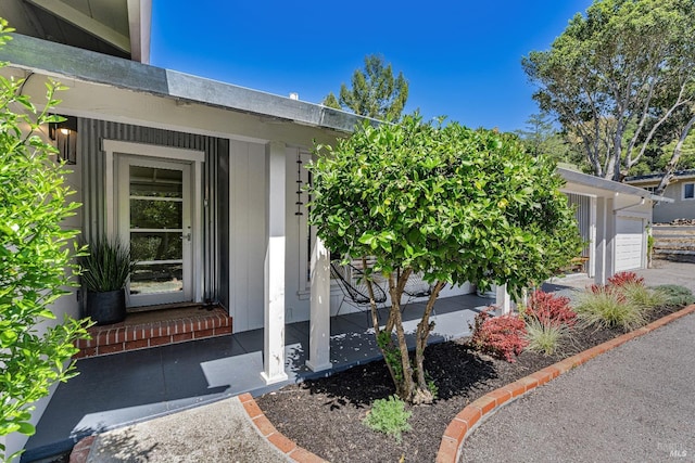 doorway to property featuring a garage