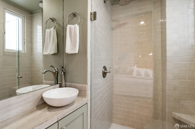 bathroom with a stall shower and vanity
