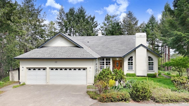 ranch-style house with a chimney, a shingled roof, concrete driveway, and an attached garage
