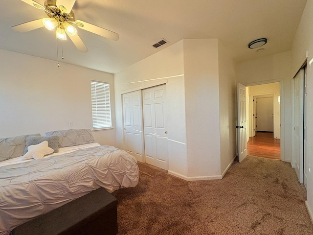 bedroom featuring ceiling fan, a closet, visible vents, carpet flooring, and baseboards