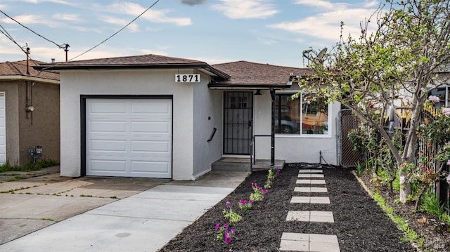 single story home featuring stucco siding, concrete driveway, a shingled roof, and a garage