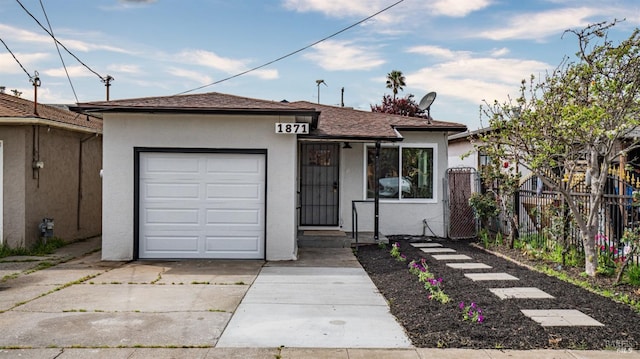 ranch-style home featuring fence, stucco siding, driveway, roof with shingles, and a garage