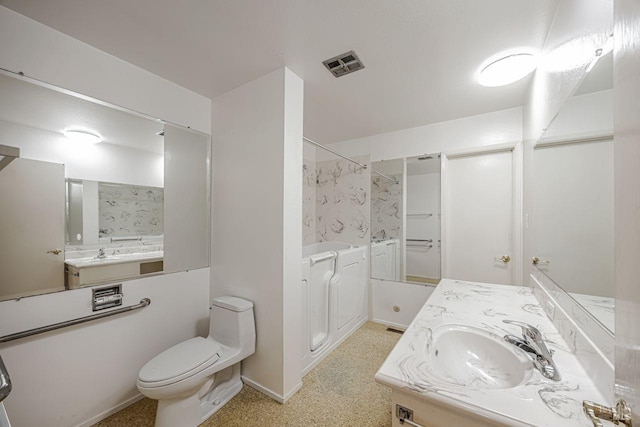 bathroom featuring baseboards, visible vents, toilet, and vanity