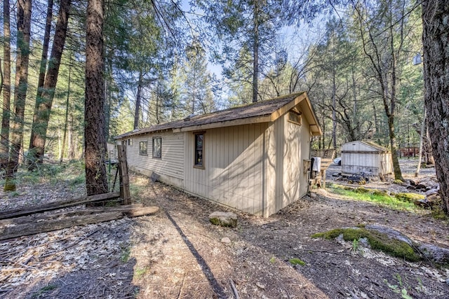 view of side of home with an outbuilding
