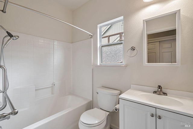 full bathroom with bathing tub / shower combination, vanity, and toilet