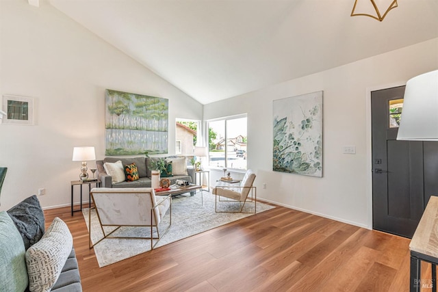 141 Albatrosse Way, Vallejo, CA 94589 - living room featuring wood finished floors, high vaulted ceiling, and baseboards
