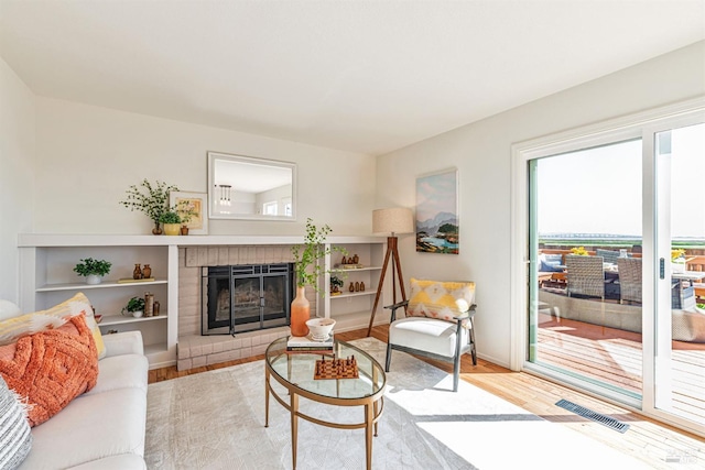 141 Albatrosse Way, Vallejo, CA 94589 - living area featuring a fireplace, visible vents, baseboards, and wood finished floors