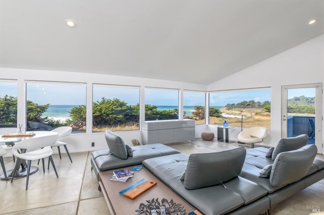 living area with a water view, high vaulted ceiling, and recessed lighting