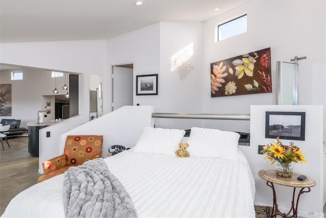 bedroom with high vaulted ceiling and recessed lighting