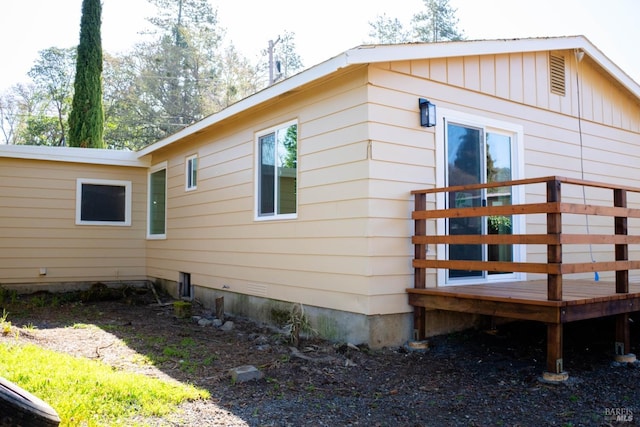 view of side of property with a deck