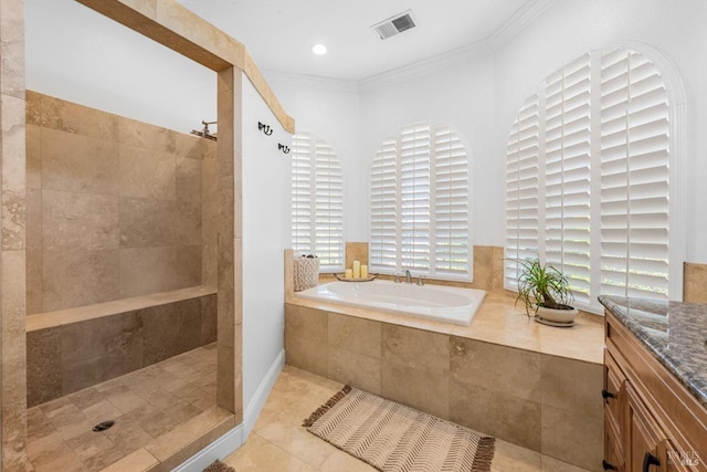 full bath with a garden tub, crown molding, tile patterned floors, walk in shower, and visible vents