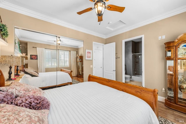 bedroom featuring baseboards, wood finished floors, ornamental molding, and ceiling fan