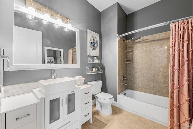 full bath with tile patterned flooring, shower / bath combo with shower curtain, toilet, and vanity