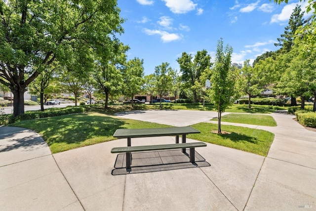 view of home's community with a lawn