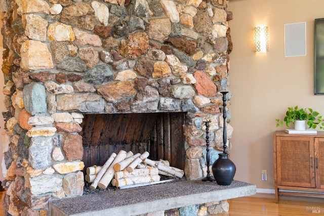 interior details featuring baseboards and wood finished floors