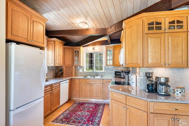kitchen with white appliances, light wood-style floors, wood ceiling, and a sink