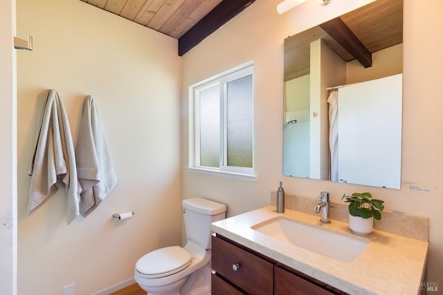 bathroom featuring toilet, wooden ceiling, vanity, and beam ceiling