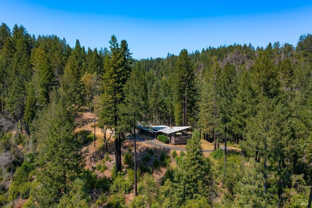 bird's eye view featuring a forest view
