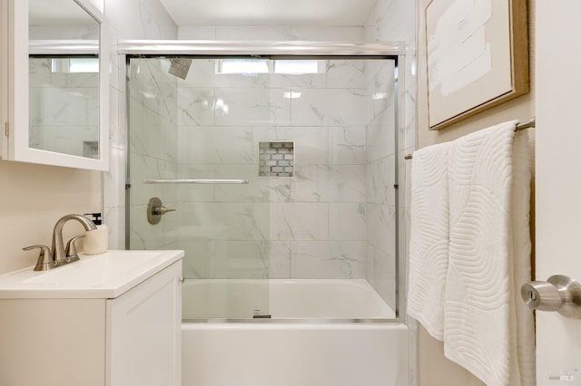full bathroom featuring vanity and combined bath / shower with glass door