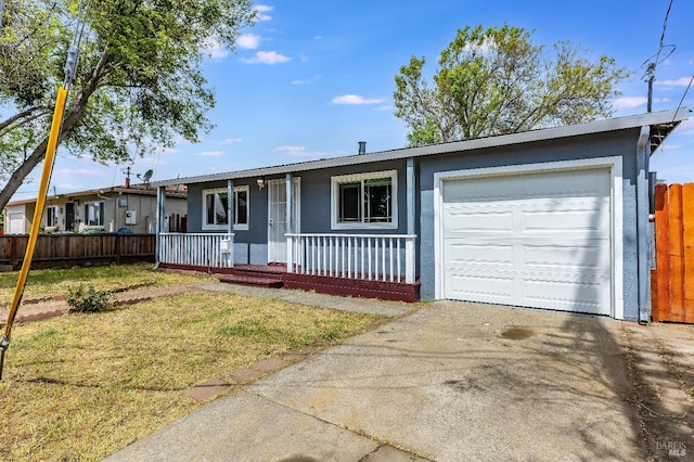ranch-style house with a porch, an attached garage, fence, a front lawn, and driveway