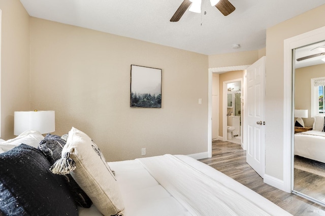 bedroom with baseboards, a ceiling fan, and wood finished floors