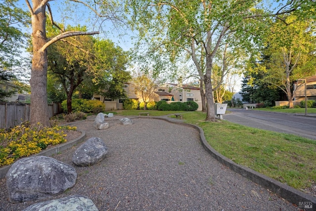 view of yard with a residential view and fence