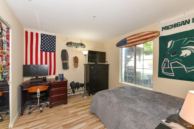 bedroom featuring wood finished floors