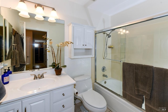 bathroom featuring shower / bath combination with glass door, vanity, and toilet