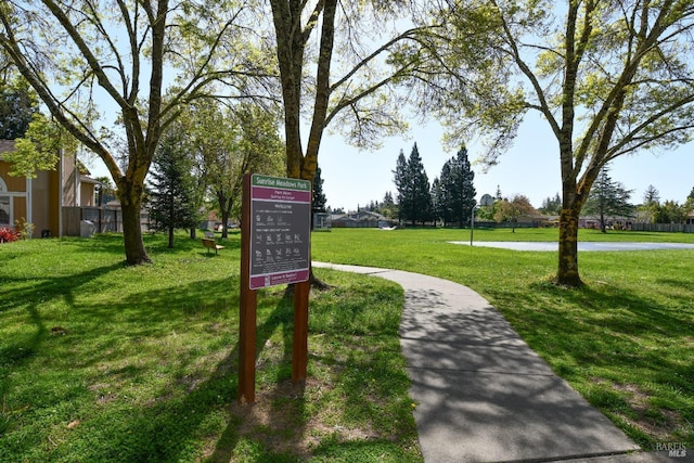 surrounding community featuring a lawn