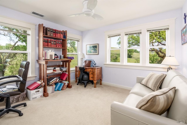 office with visible vents, baseboards, a ceiling fan, and carpet floors