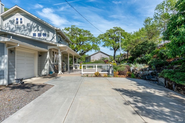view of front of home featuring a porch and driveway