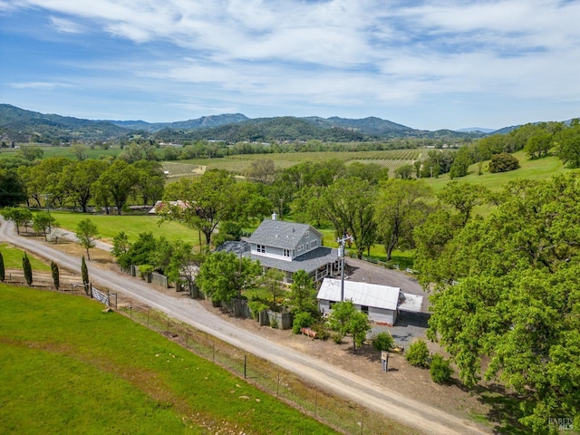 drone / aerial view featuring a rural view and a mountain view