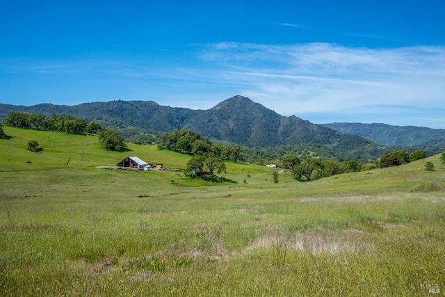view of mountain feature with a rural view