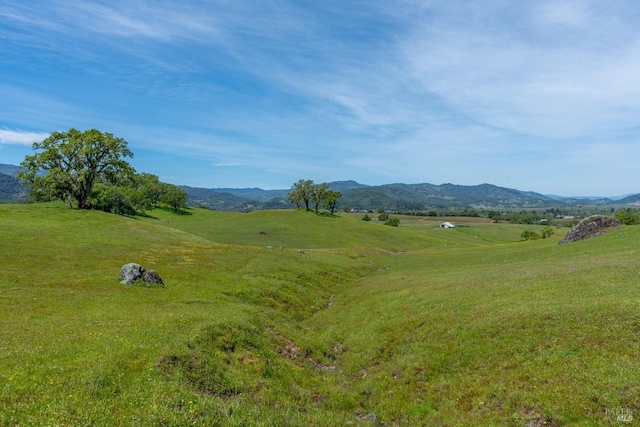 view of mountain feature with a rural view