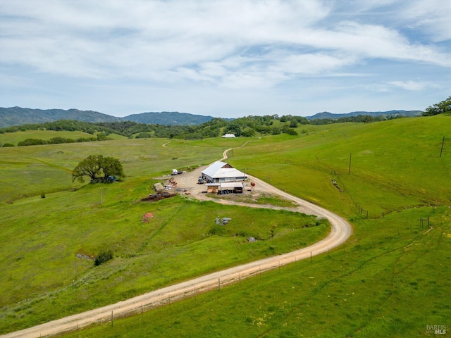 drone / aerial view with a rural view and a mountain view