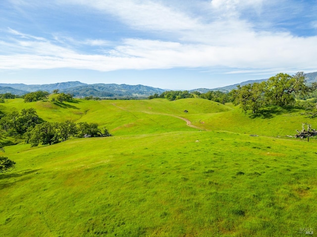 surrounding community featuring a mountain view