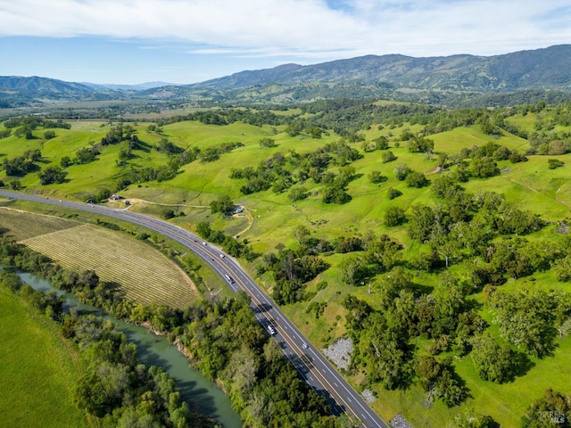 birds eye view of property with a mountain view
