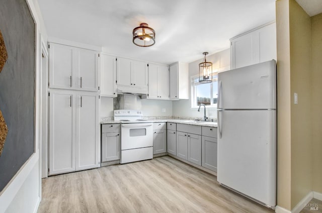 kitchen with light wood-style floors, white appliances, gray cabinets, under cabinet range hood, and a sink