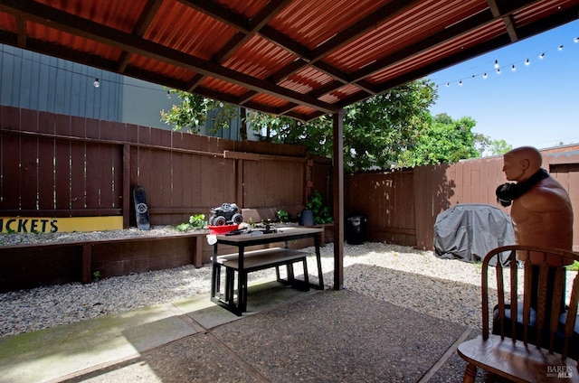 view of patio / terrace featuring area for grilling and a fenced backyard