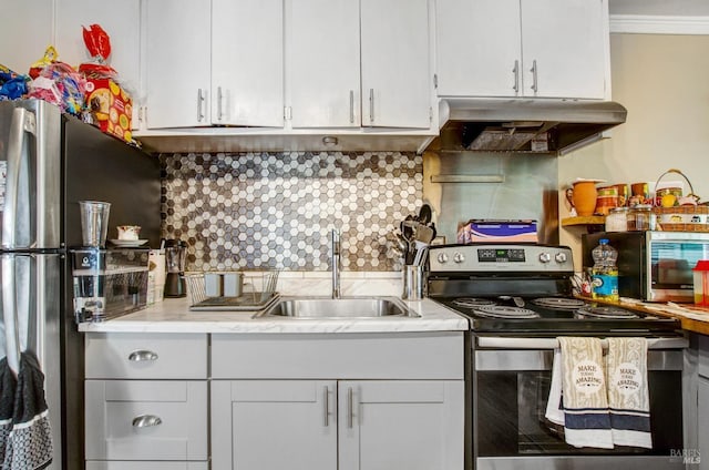kitchen featuring white cabinets, a sink, light countertops, appliances with stainless steel finishes, and under cabinet range hood
