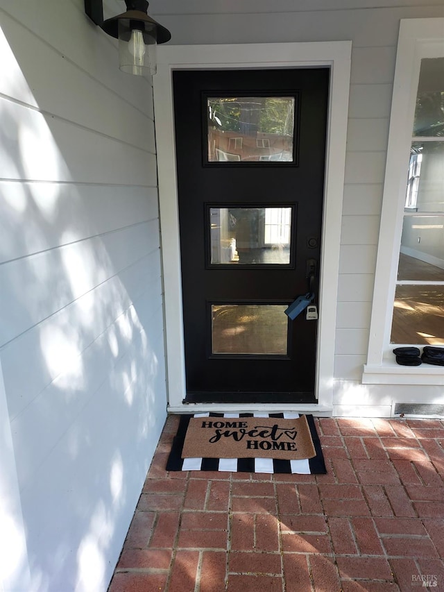 doorway to property with a ceiling fan