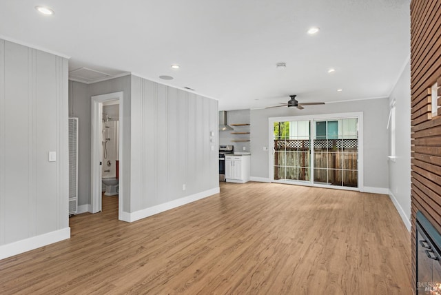 unfurnished living room with baseboards, ornamental molding, light wood-type flooring, a ceiling fan, and recessed lighting