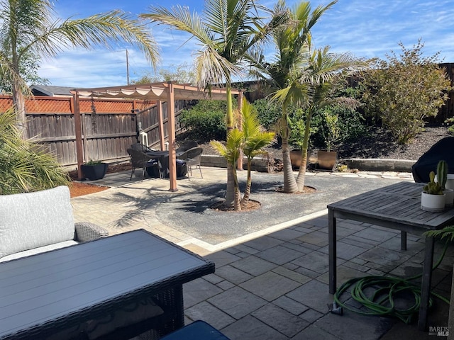 view of patio featuring a fenced backyard and a pergola