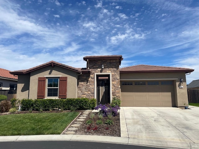 prairie-style house featuring an attached garage, a tiled roof, concrete driveway, and stucco siding