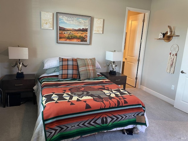 bedroom featuring baseboards and carpet