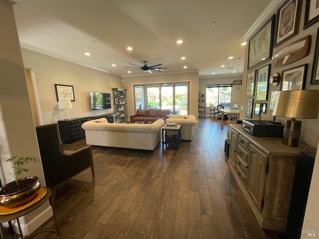 living room with recessed lighting, ceiling fan, ornamental molding, and dark wood finished floors